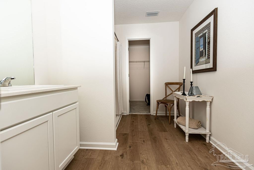 4776 Eagles Rdg Road Pace, FL 32571 - Photo 11 of 19 a room with a sink and a wooden floor