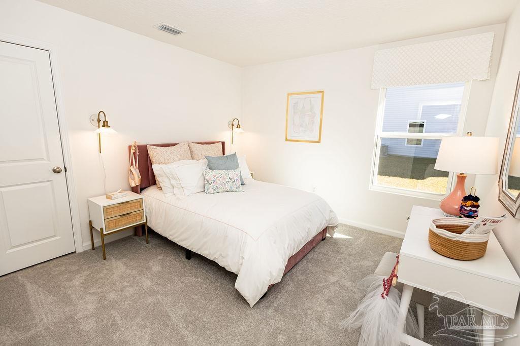 4776 Eagles Rdg Road Pace, FL 32571 - Photo 18 of 19 a bedroom with a bed and dresser