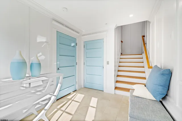 a bedroom with a large bed and a large window