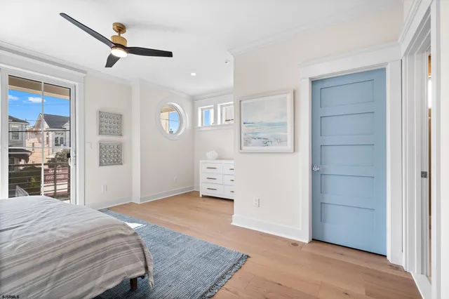 a bedroom with a large bed and a window