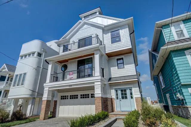 an aerial view of a house with a lake view