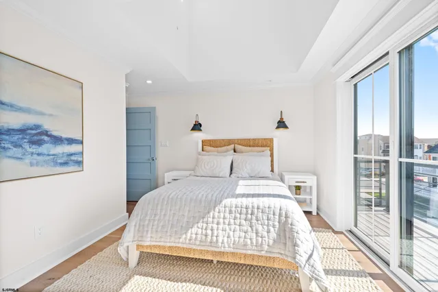 a dining room with furniture window and wooden floor
