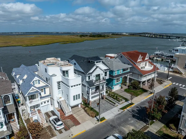 an aerial view of a house with ocean view