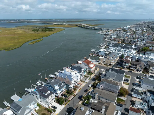 a kitchen with a table chairs stove and refrigerator