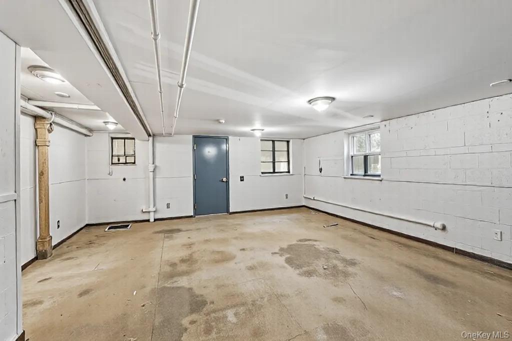 61-12 Main Street Queens, NY 11367 - Photo 13 of 35 Garage with concrete block wall