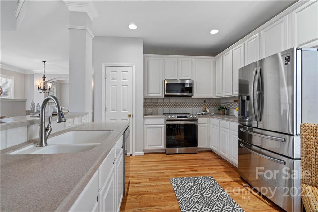 412 Third Baxter Street Fort Mill, SC 29708 - Photo 13 of 39 a kitchen with kitchen island granite countertop a sink stainless steel appliances and cabinets