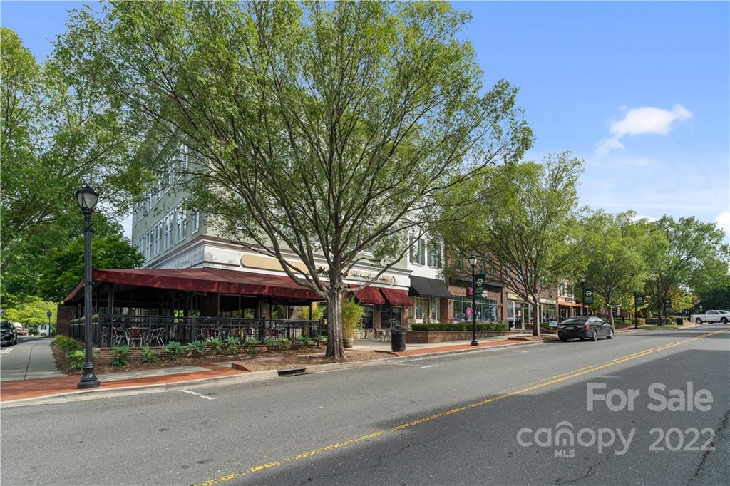 412 Third Baxter Street Fort Mill, SC 29708 - Photo 35 of 39 a front view of a building with street and trees