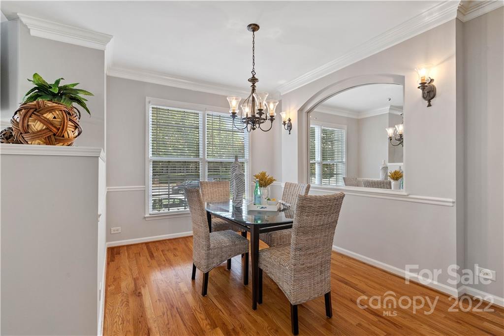412 Third Baxter Street Fort Mill, SC 29708 - Photo 7 of 39 a view of a dining room with furniture window and wooden floor