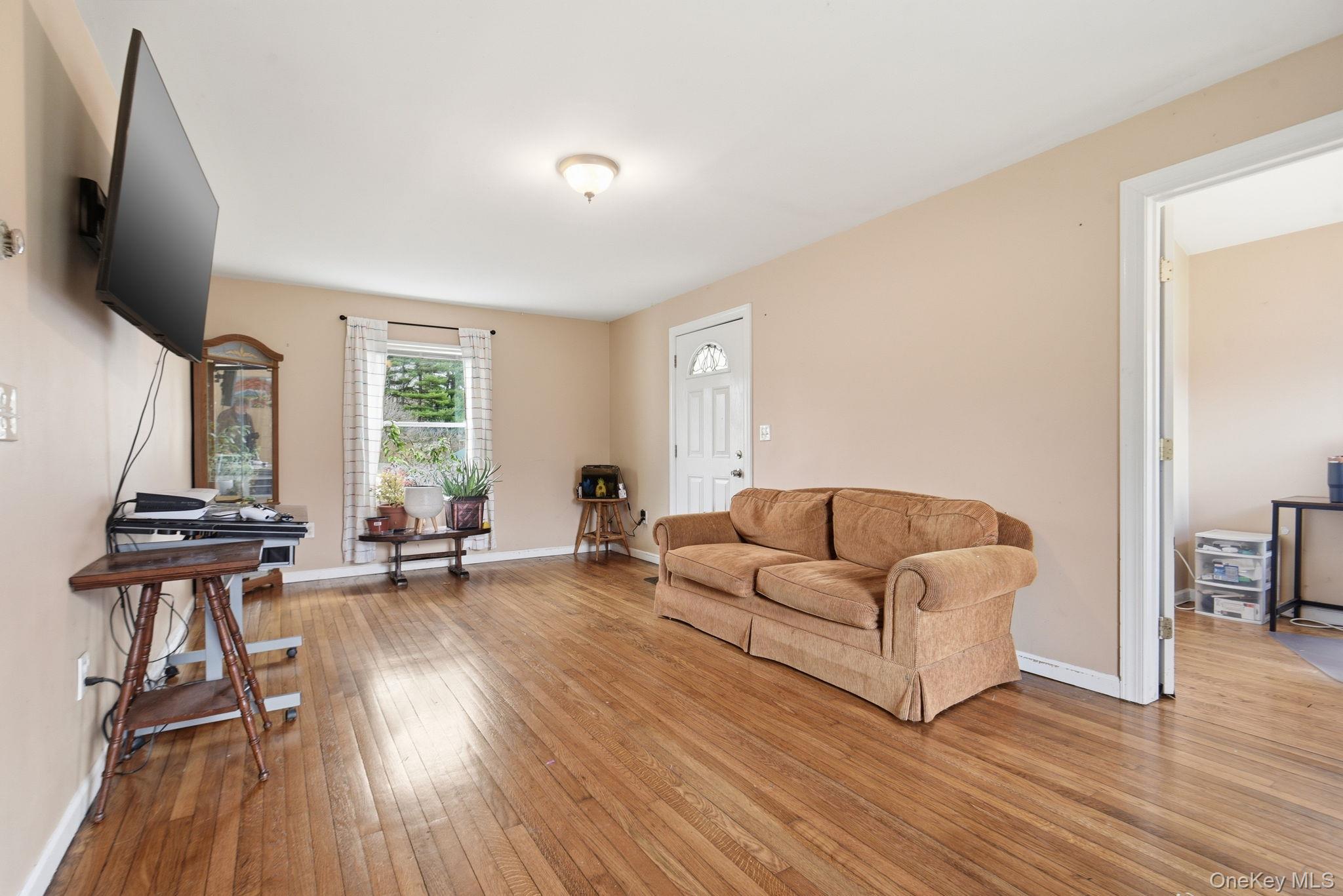 41 Beilke Road Millerton, NY 12546 - Photo 13 of 26 a living room with furniture and a flat screen tv