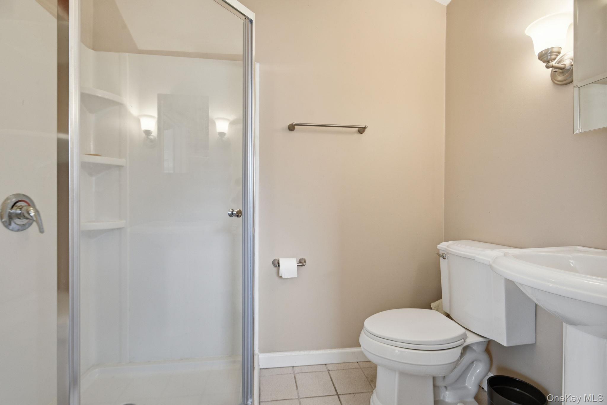 41 Beilke Road Millerton, NY 12546 - Photo 15 of 26 a white toilet sitting next to a bathroom sink