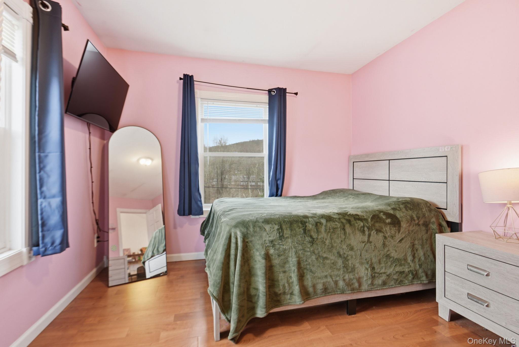 41 Beilke Road Millerton, NY 12546 - Photo 18 of 26 a bed sitting in a bedroom next to a window