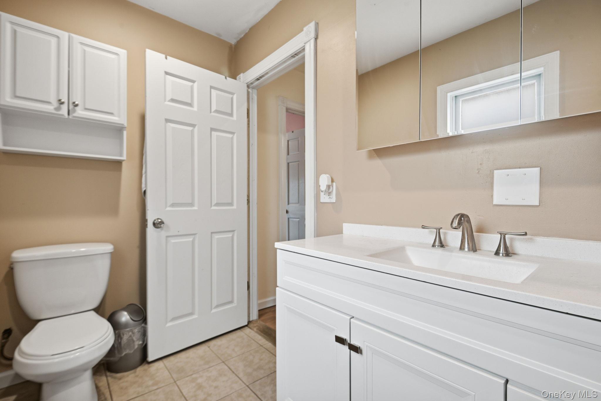 41 Beilke Road Millerton, NY 12546 - Photo 19 of 26 a bathroom with a toilet sink vanity and granite