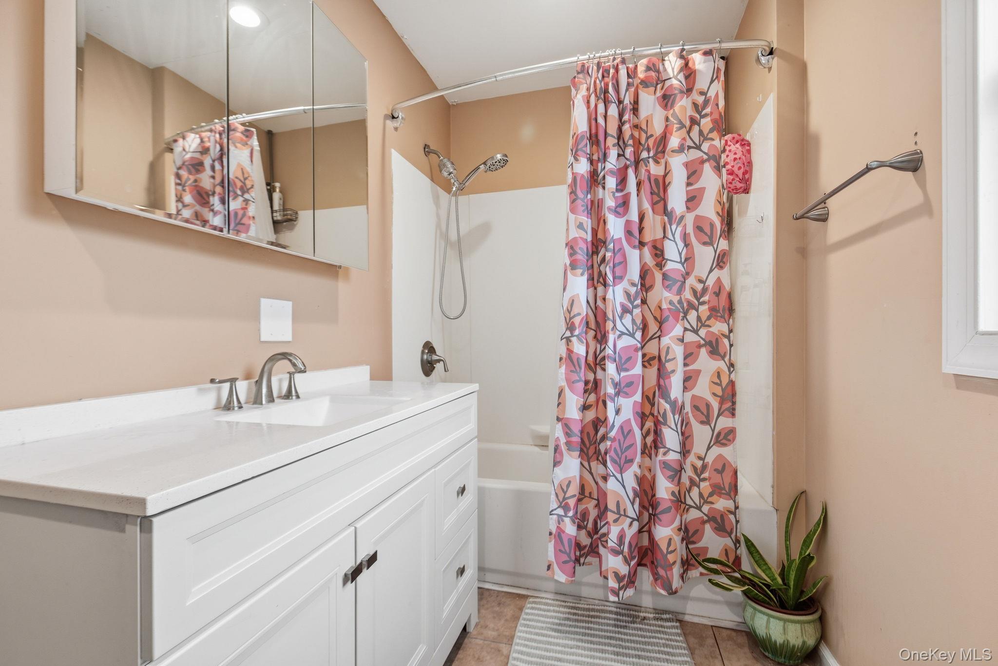 41 Beilke Road Millerton, NY 12546 - Photo 20 of 26 a bathroom with a sink a mirror and a shower curtain
