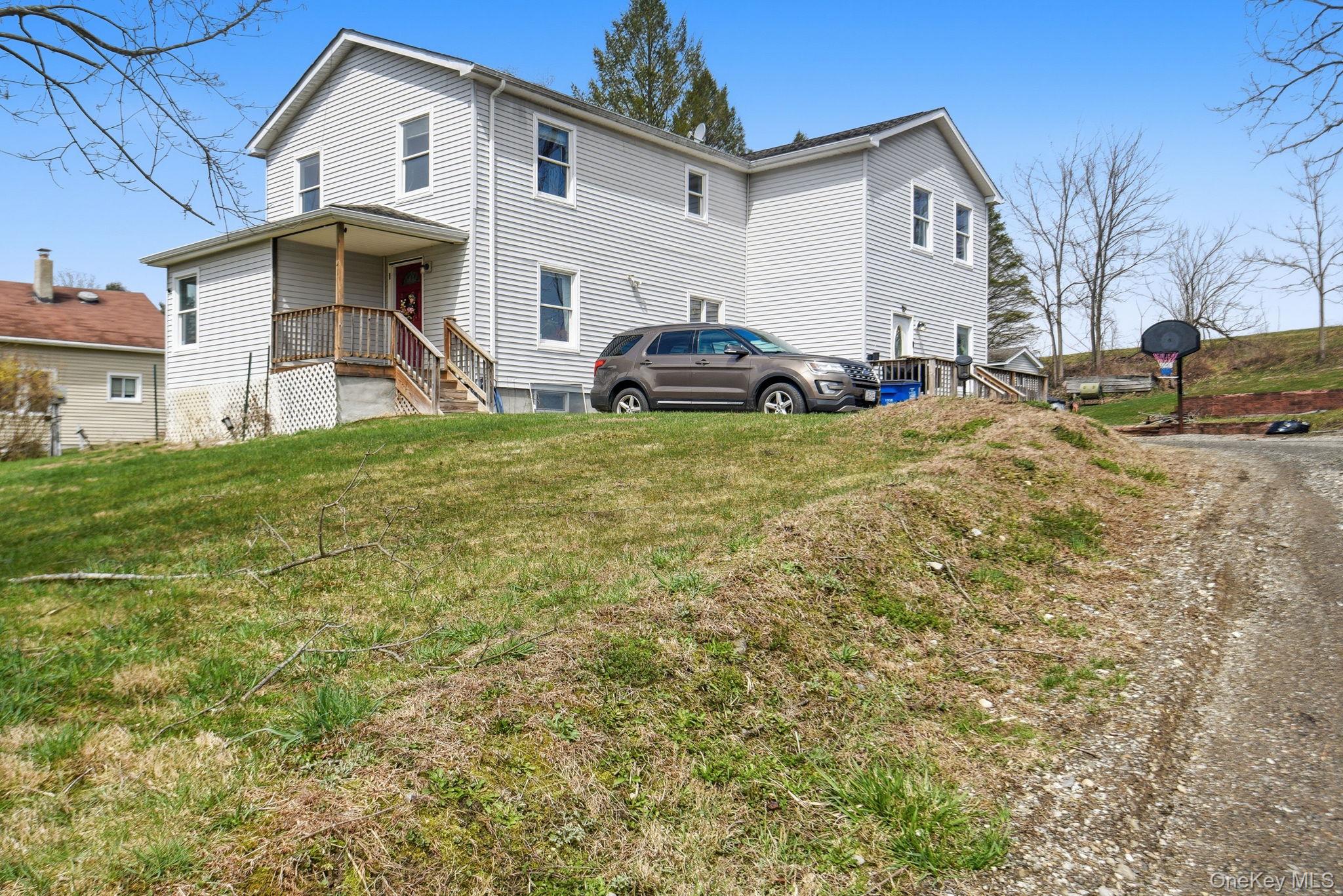 41 Beilke Road Millerton, NY 12546 - Photo 2 of 26 a front view of a house with a yard