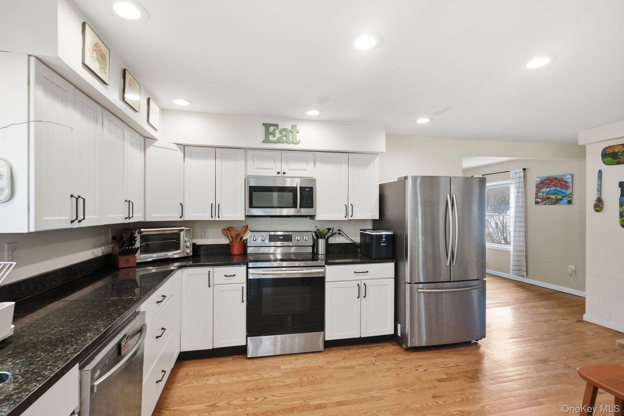 41 Beilke Road Millerton, NY 12546 - Photo 10 of 26 a kitchen with stainless steel appliances a sink a stove a refrigerator cabinets and a counter top space
