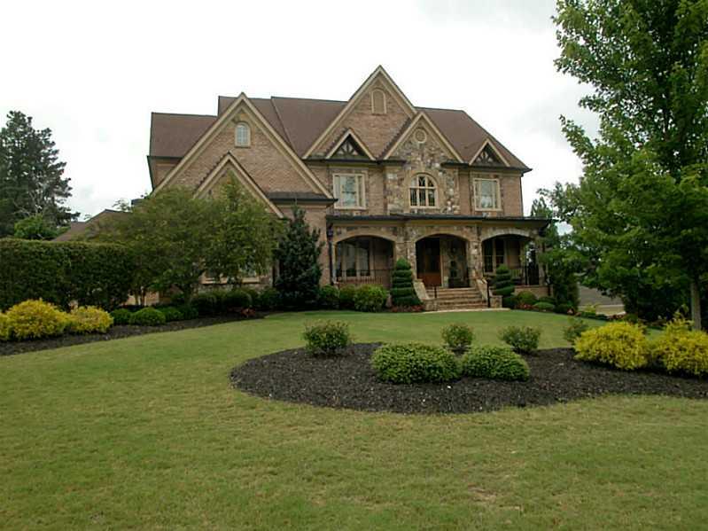 3110 Wills Mill Road Cumming, GA 30041 - Photo 1 of 1 Exterior Front. Gorgeous 4 side brick home on corner lot. Copper roofing details. Architectural stone features beautifully lit at night! Stunning inside and out!