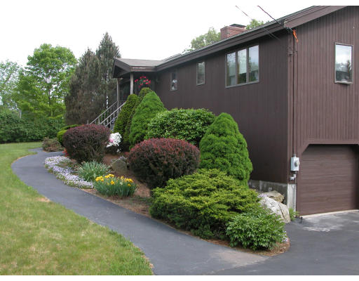 406 Boston Road Groton, MA 01450 - Photo 12 of 13 a brick building with a yard
