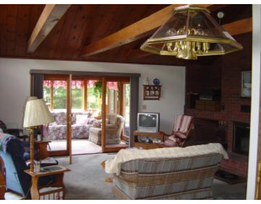 406 Boston Road Groton, MA 01450 - Photo 2 of 13 a living room with furniture and a large window
