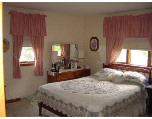 406 Boston Road Groton, MA 01450 - Photo 3 of 13 a bedroom with a bed and window