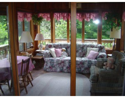 406 Boston Road Groton, MA 01450 - Photo 4 of 13 a living room with furniture and a large window