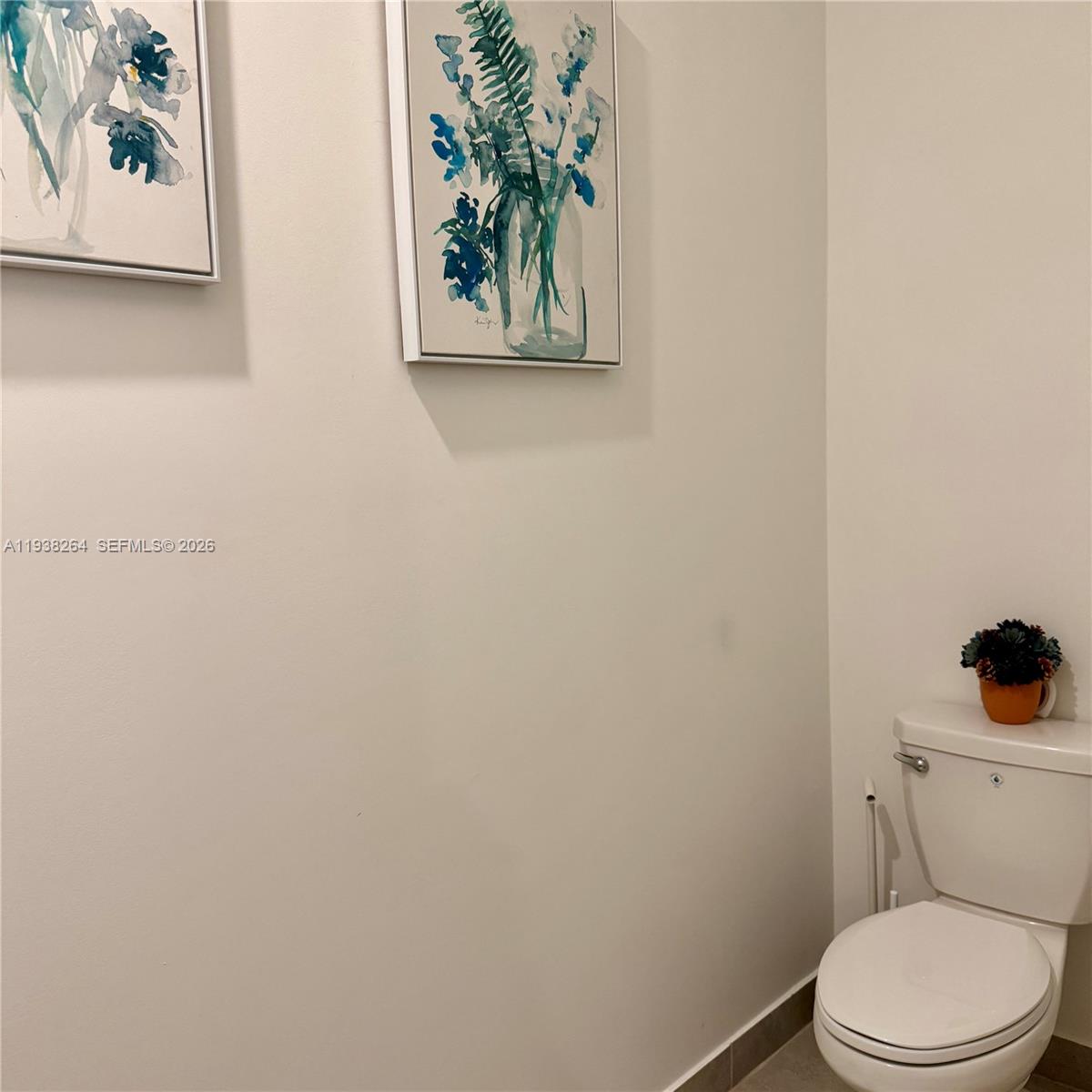 23049 Southwest 129th Place Miami, FL 33177 - Photo 13 of 29 a white toilet sitting next to a white wall