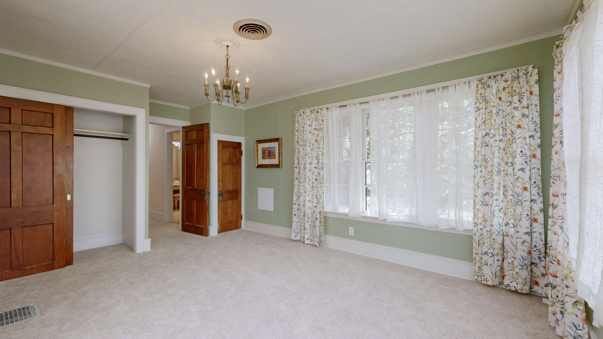 1007 Poplar Street Murray, KY 42071 - Photo 24 of 48 a view of a livingroom with a chandelier fan and windows