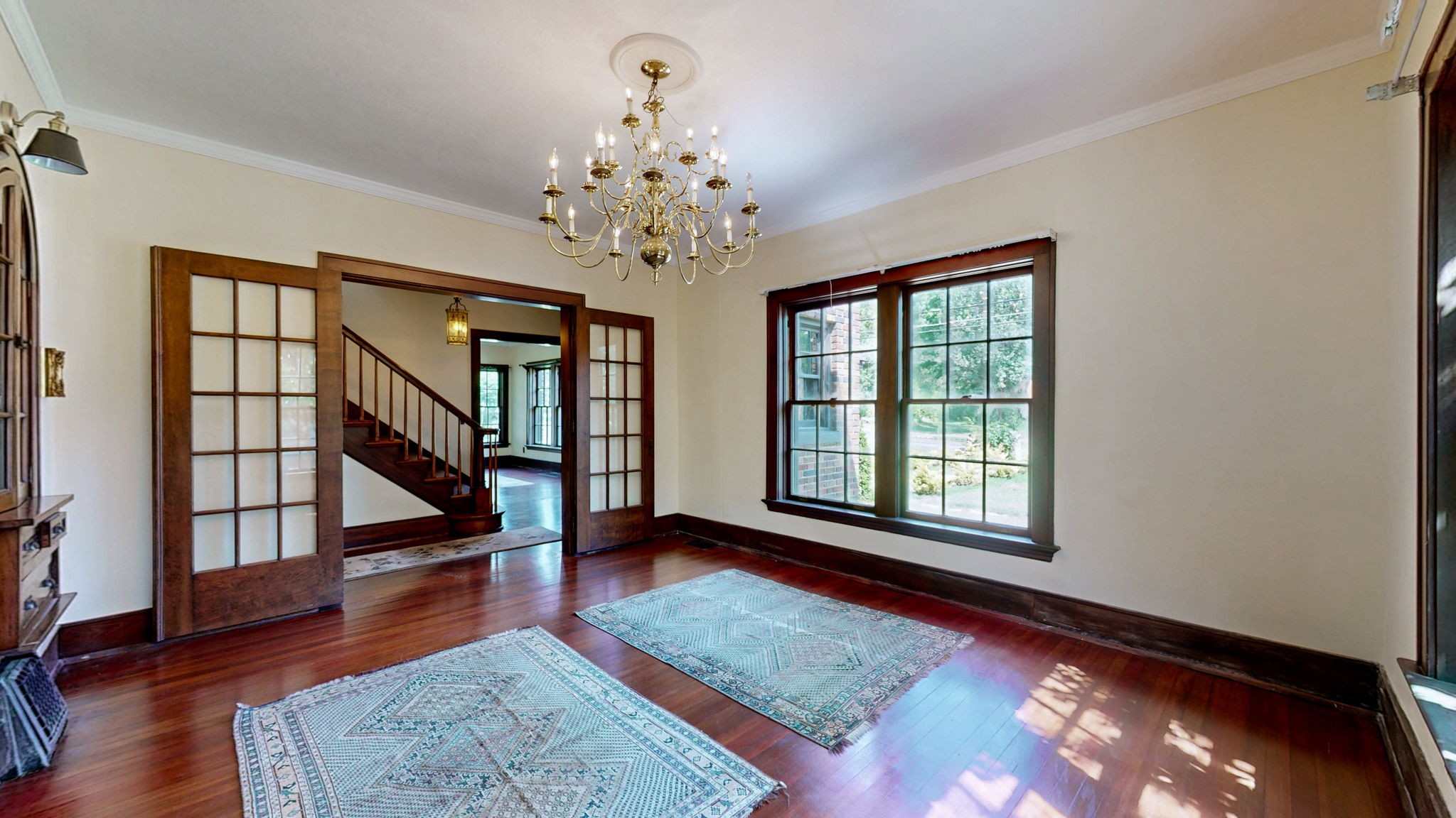 1007 Poplar Street Murray, KY 42071 - Photo 7 of 48 a view of an empty room with wooden floor and a window