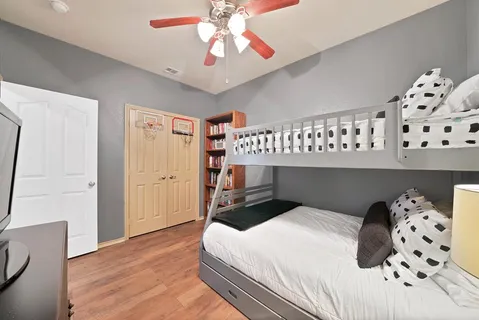 a bedroom with a bed and a dresser