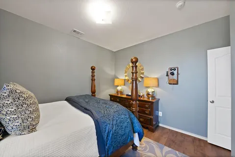 a bed room with a bed and a book shelf