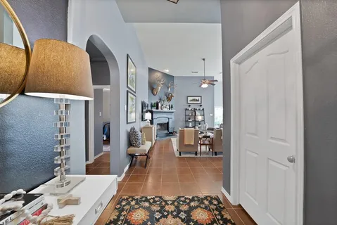 a living room with furniture and a rug