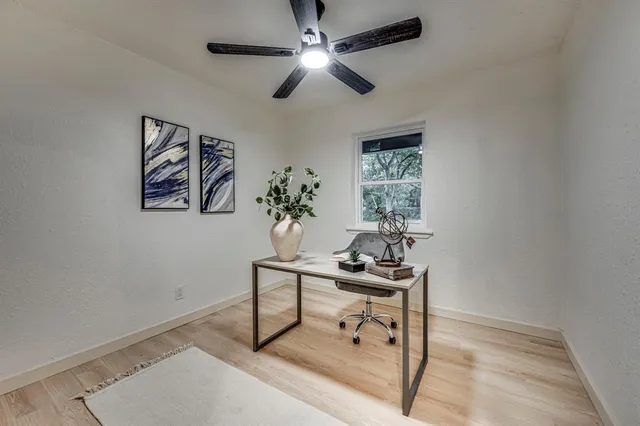 a workspace with furniture and window