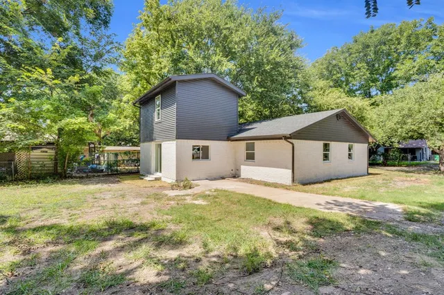 a house with yard in front of it