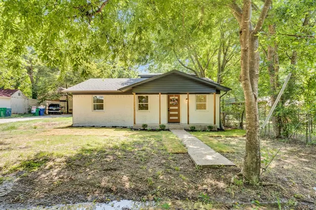 a house with trees in the background