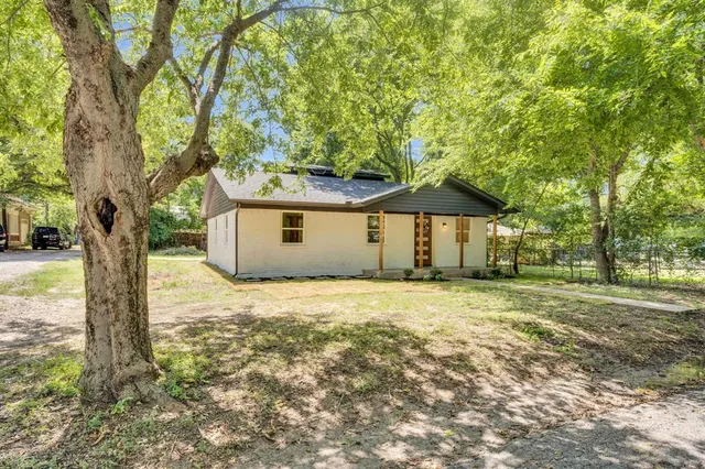 a house with trees in front of it