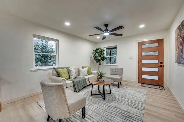 a living room with furniture and a window