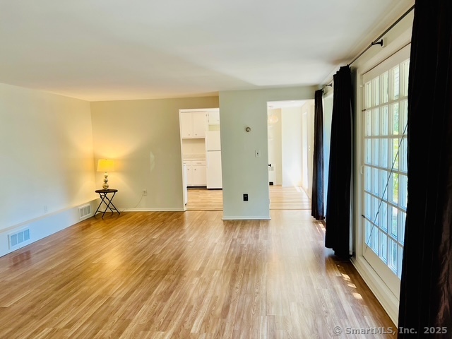 2820 High Ridge Road Stamford, CT 06903 - Photo 12 of 25 wooden floor in an empty room with a window