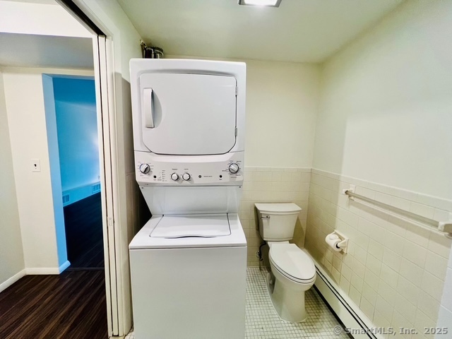 2820 High Ridge Road Stamford, CT 06903 - Photo 18 of 25 a white toilet sitting next to a bathroom sink