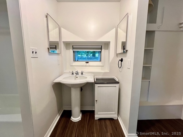 2820 High Ridge Road Stamford, CT 06903 - Photo 19 of 25 a view of utility room with sink and wooden floor