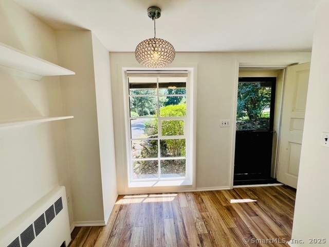 2820 High Ridge Road Stamford, CT 06903 - Photo 5 of 25 a view of an empty room with glass door and wooden floor