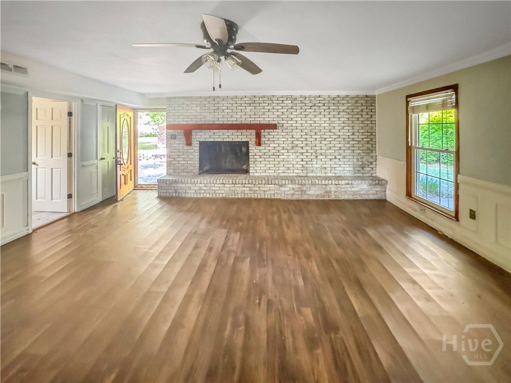 209 Lewis Drive Rincon, GA 31326 - Photo 8 of 14 Den with fireplace