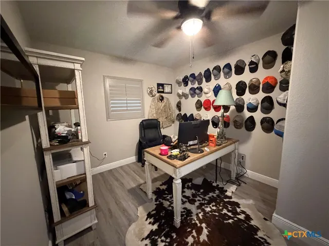 a very nice looking room with many windows and furniture