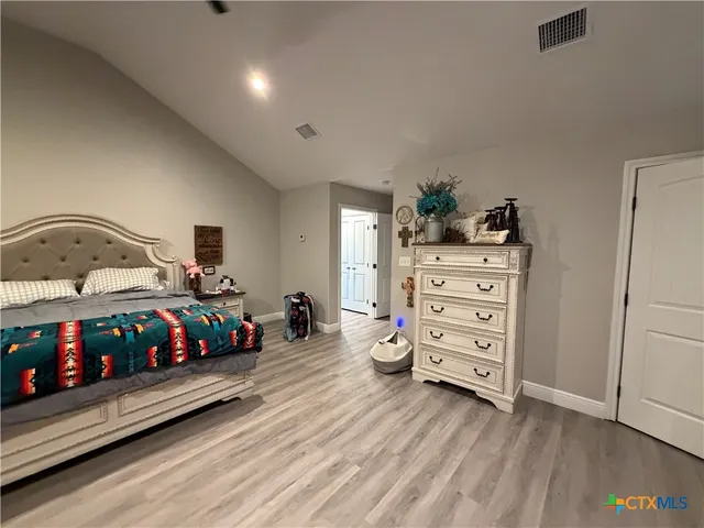 a bedroom with a bed and a closet