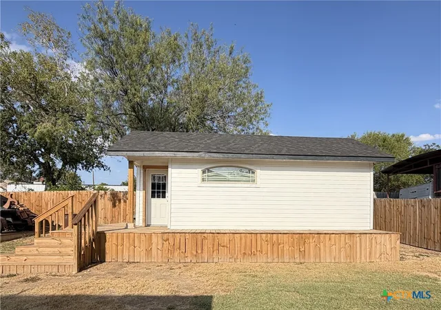 a view of a house with a roof deck