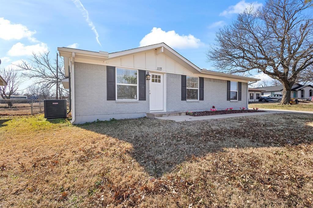 1135 Reed Circle Howe, TX 75459 - Photo 3 of 28 a front view of house with yard and trees around