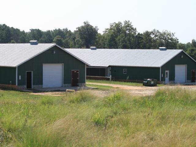 4074 Hunters Creek Road Carnesville, GA 30521 - Photo 1 of 1 a front view of a house with a yard and garage