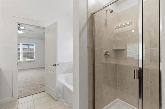a bathroom with a shower and a mirror
