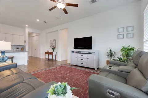 a view of a livingroom with furniture and a flat screen tv
