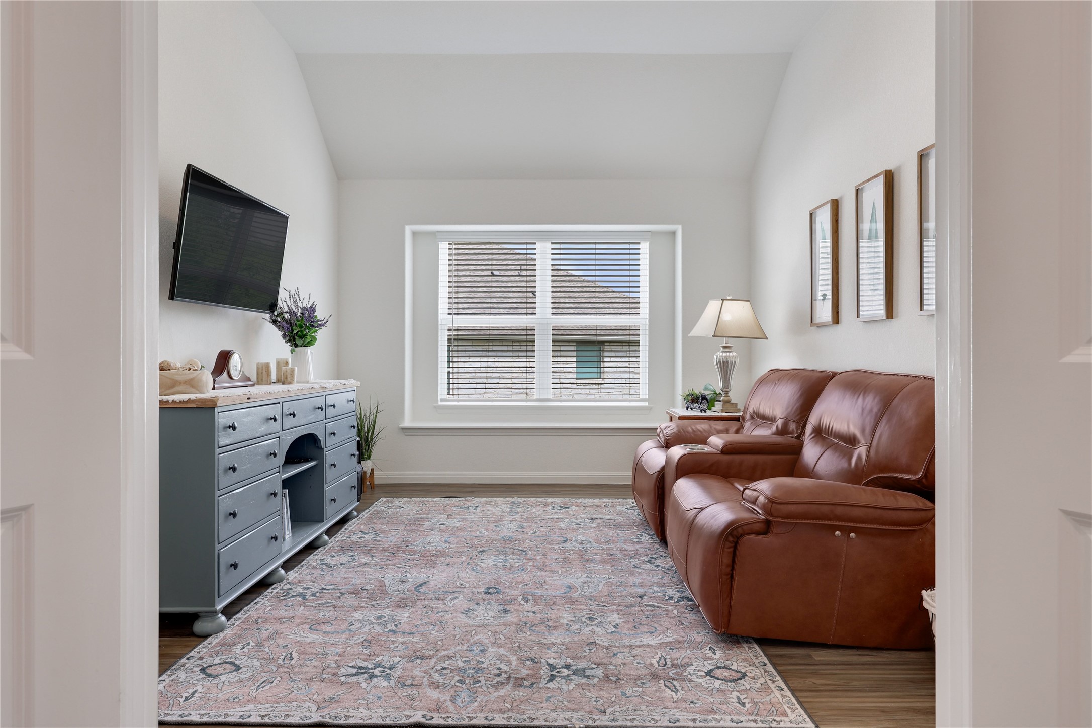 240 Prato Place Georgetown, TX 78628 - Photo 14 of 40 This versatile room features high vaulted ceilings, a large window with blinds, and wood-look flooring