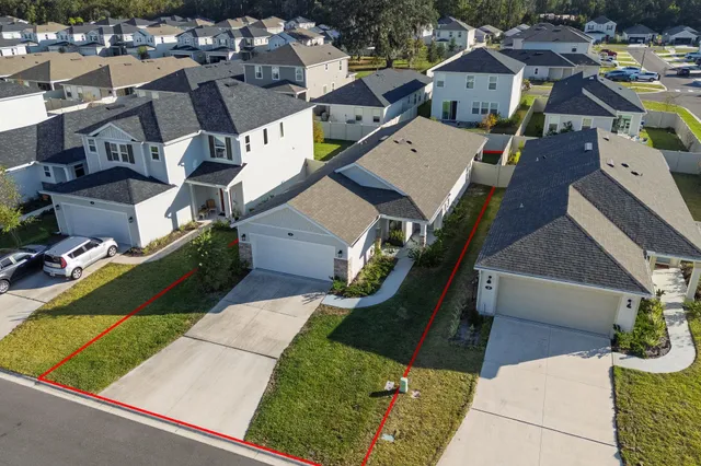 an aerial view of a house with a garden