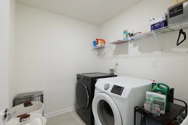 a kitchen with a sink cabinets and appliances